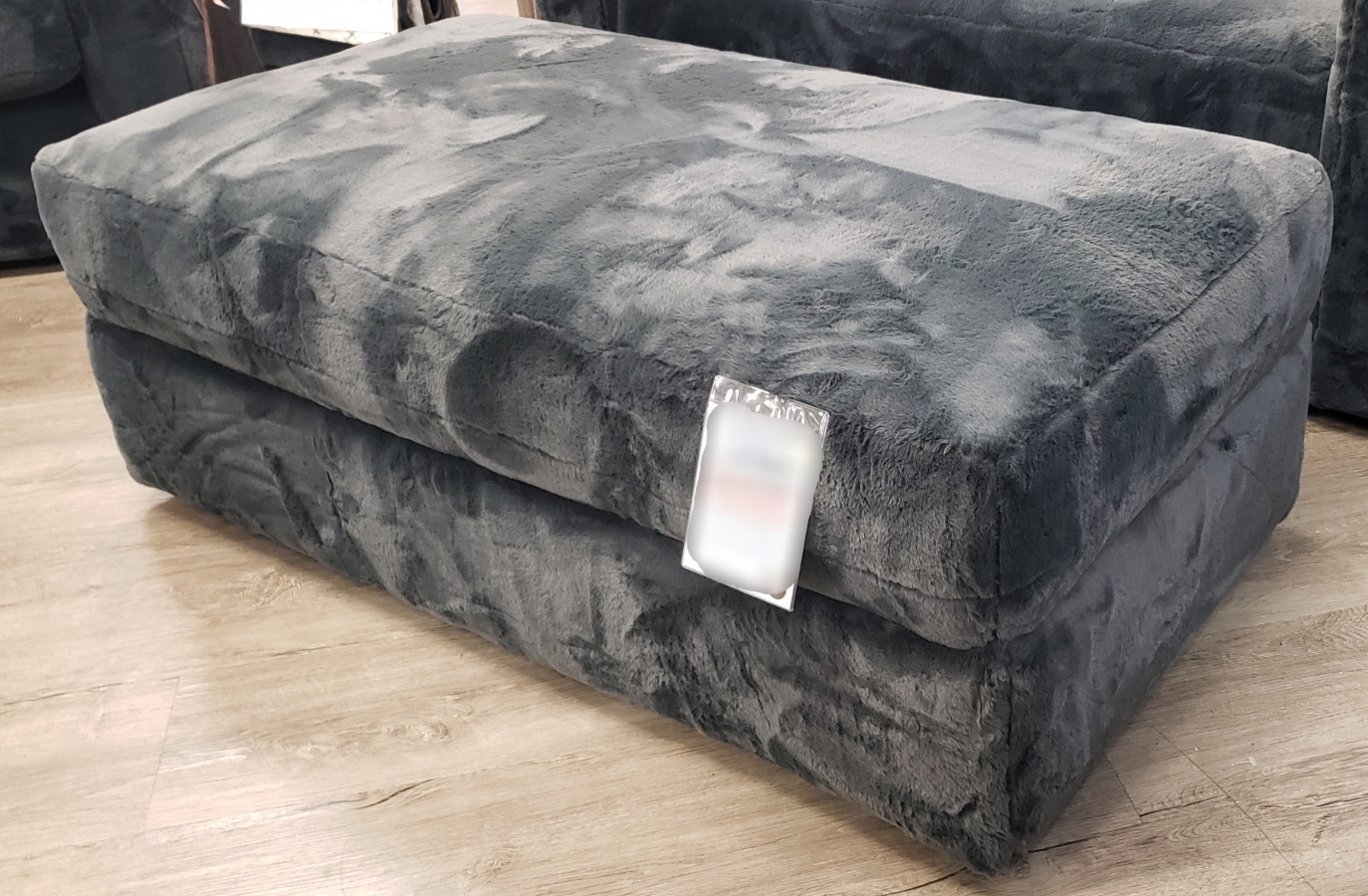 Angled view of the Stanton 568 rectangle cocktail ottoman in Badgley Granite fabric.
