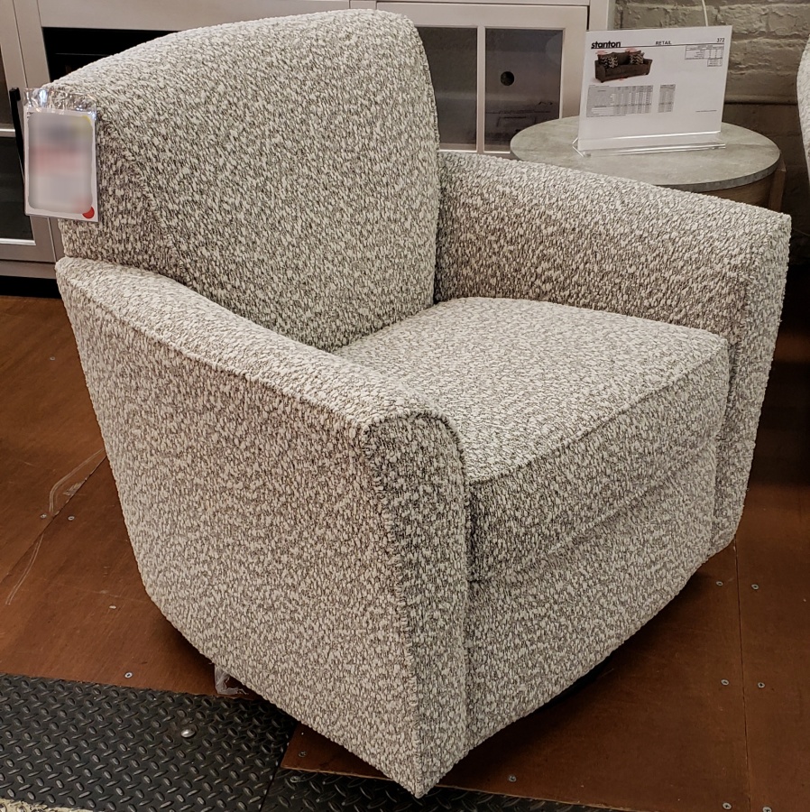 Angled view of the Stanton 976 swivel glider chair in Tatum Riverrock fabric.
